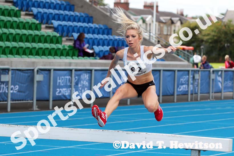 Emily Stewart on her way to winning the 3000 metres steeplechase at the Scottish Championships, Scotstoun  Stadium, Glasgow.